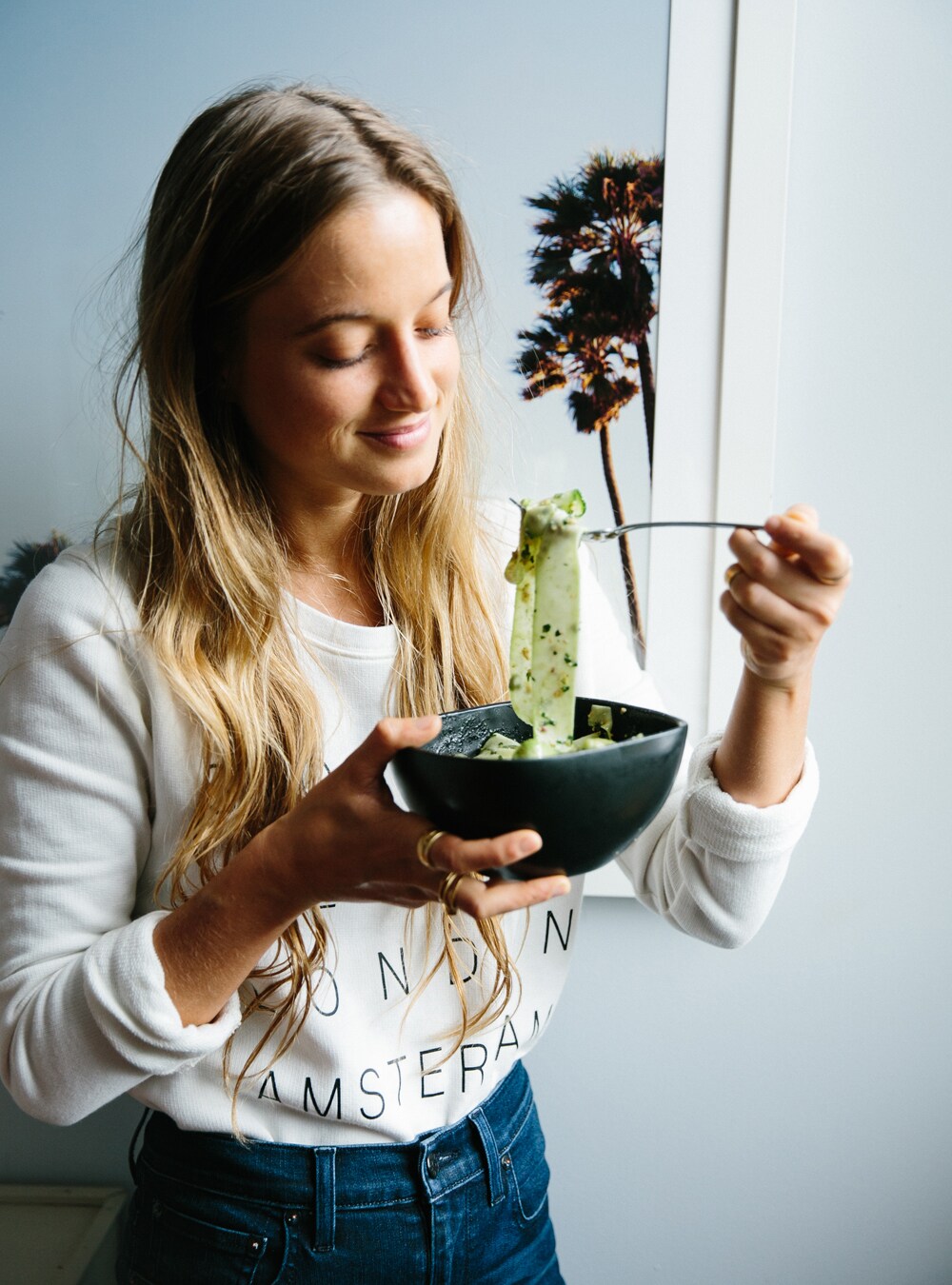 Here, Fernanda wears a Stockholm Tour Crop Sweatshirt and Rivet & Thread High Riser Jeans.
					Photography by Angi Welsch