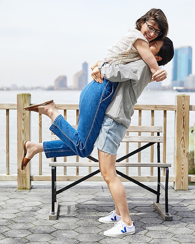 Melissa wears the Central Popover Shirt, Tapered Jeans and Boardwalk Post Slide Sandal. Jen wears the Madewell x Human Rights Campaign Love To All Pride Sweatshirt, Perfect Vintage Short and Veja™ Canvas Esplar SE Low Sneakers.