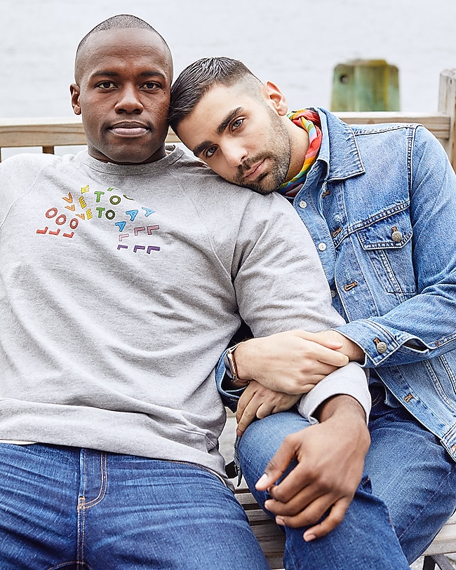 Darien wears the Madewell x Human Rights Campaign Love To All Pride Sweatshirt and Straight Jeans. Phillip wears the Classic Jean Jacket, Short-Sleeve Button-Down Workshirt, Rigid Slim Jeans and Madewell x Human Rights Campaign Rainbow Bandana.