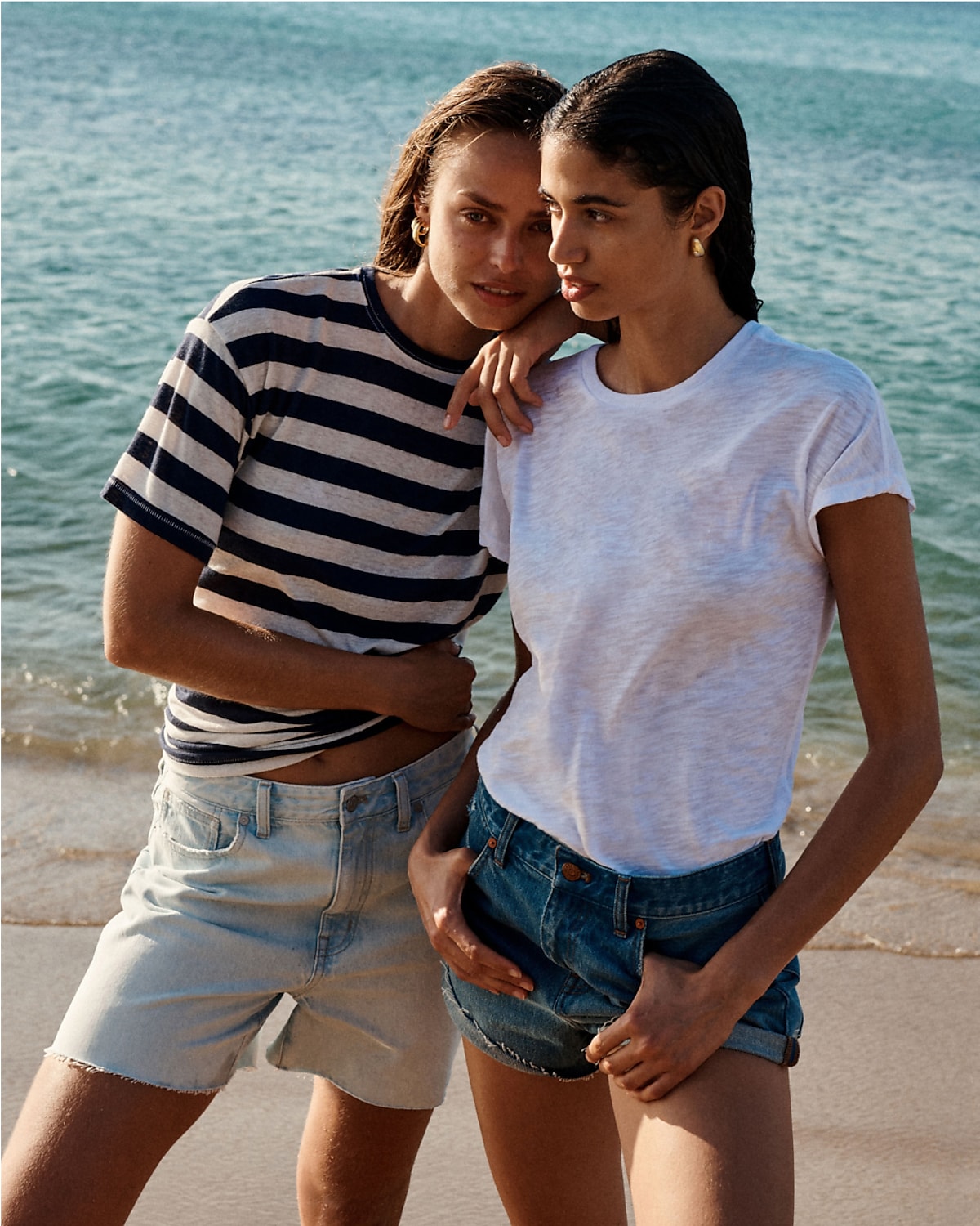 man standing in front of a parachute with classic beige shorts, white top, and a beige shirt