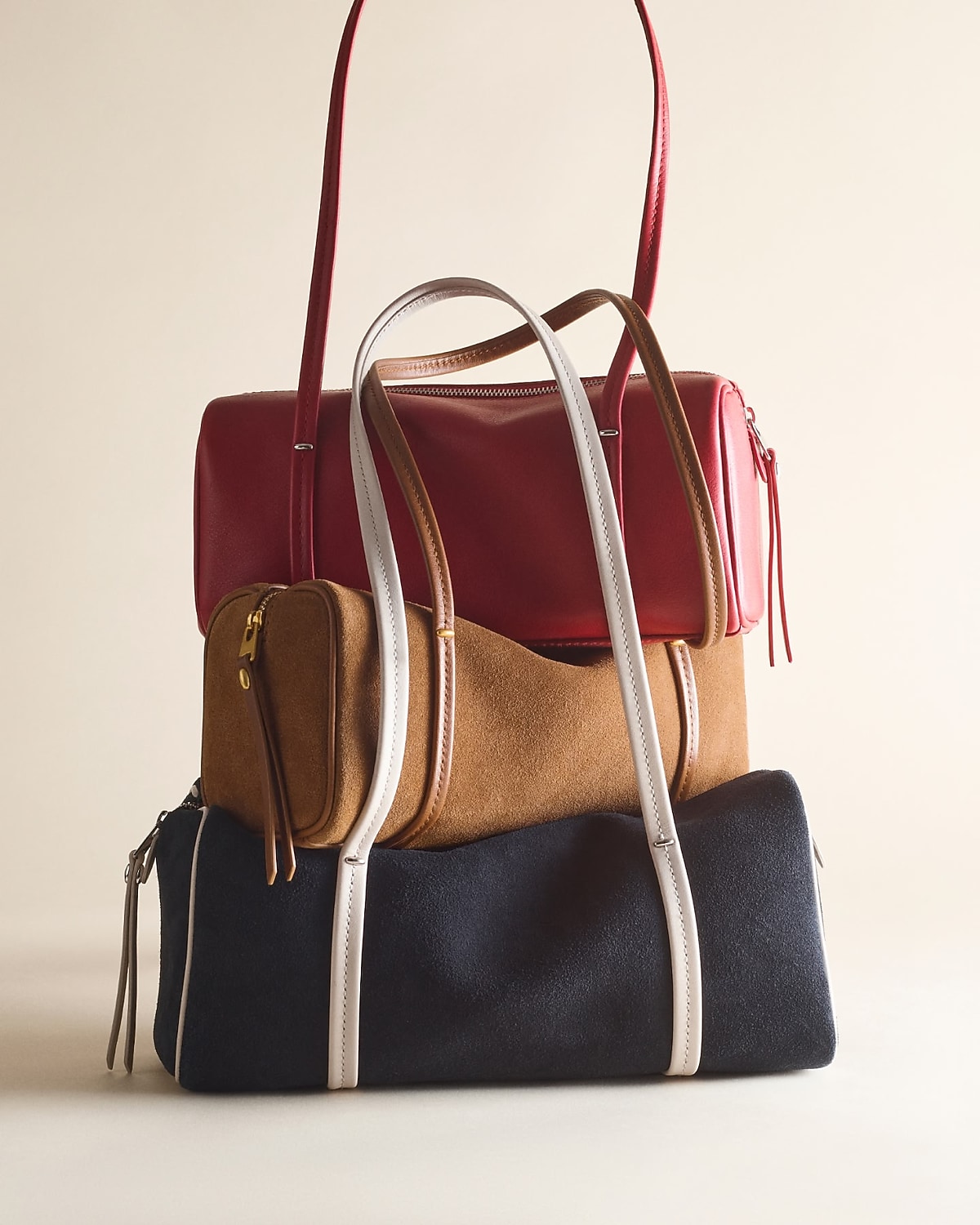man standing in front of a parachute  with classic beige shorts, white top, and a beige shirt
