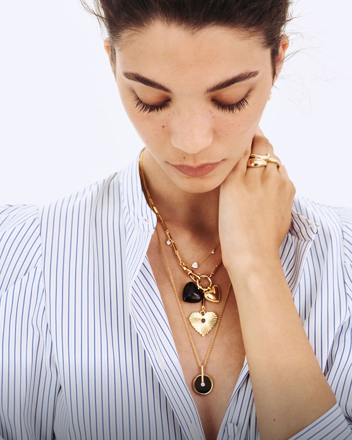 man standing in front of a parachute with classic beige shorts, white top, and a beige shirt