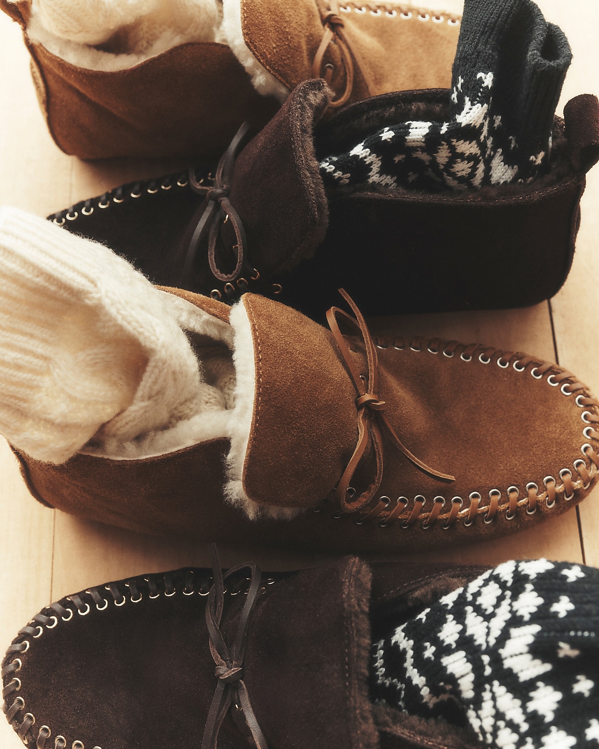 man standing in front of a parachute with classic beige shorts, white top, and a beige shirt
