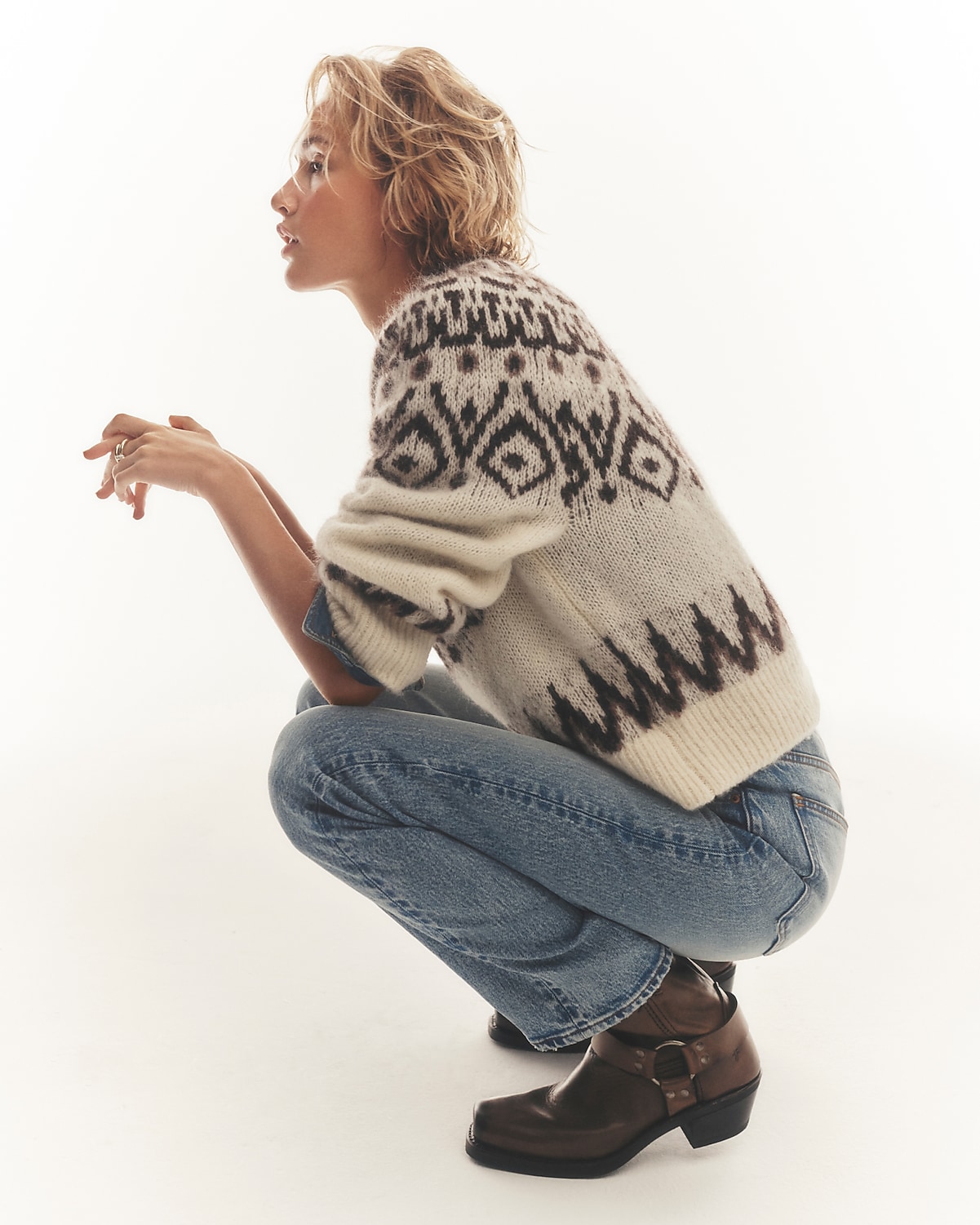 man standing in front of a parachute with classic beige shorts, white top, and a beige shirt