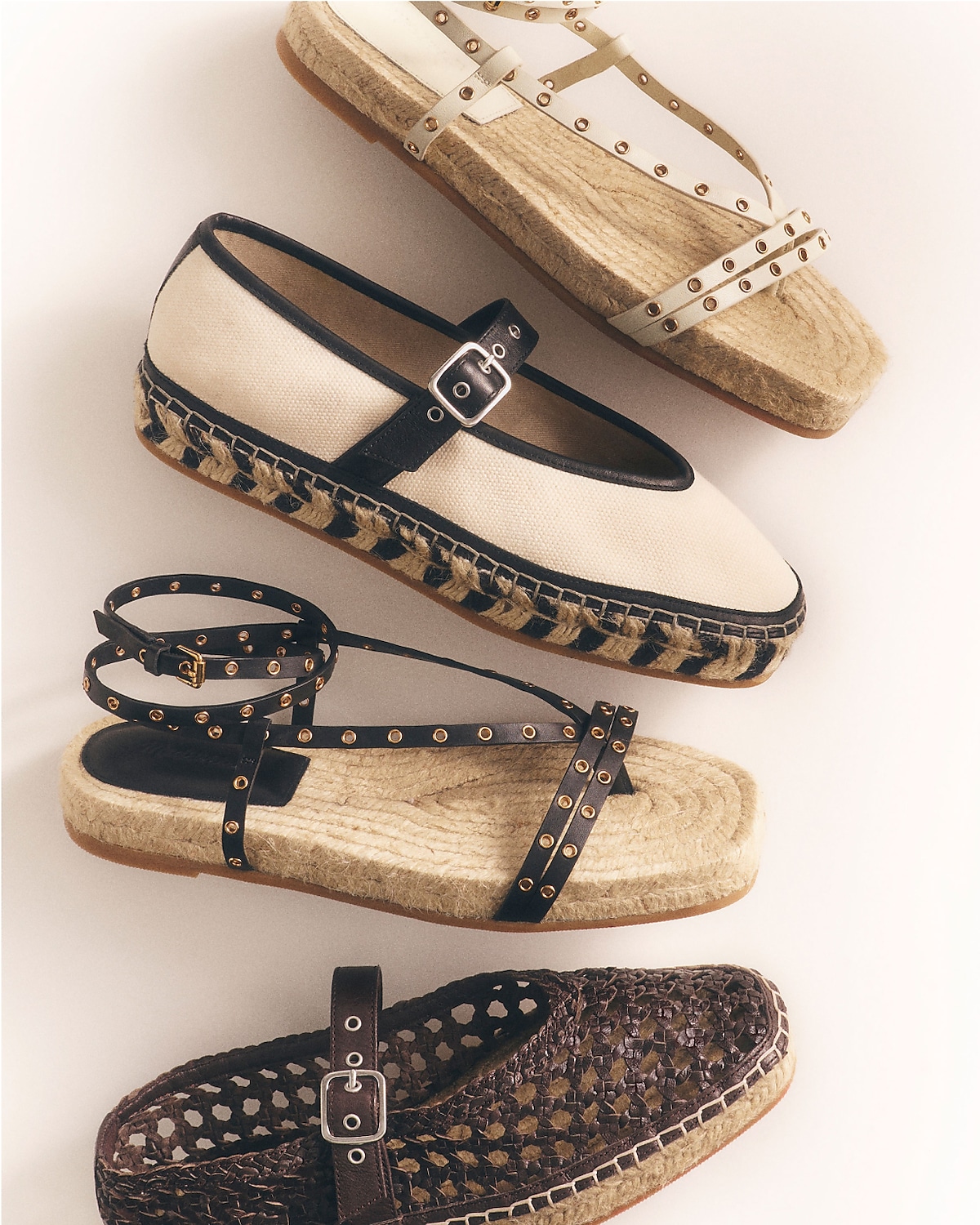 man standing in front of a parachute with classic beige shorts, white top, and a beige shirt