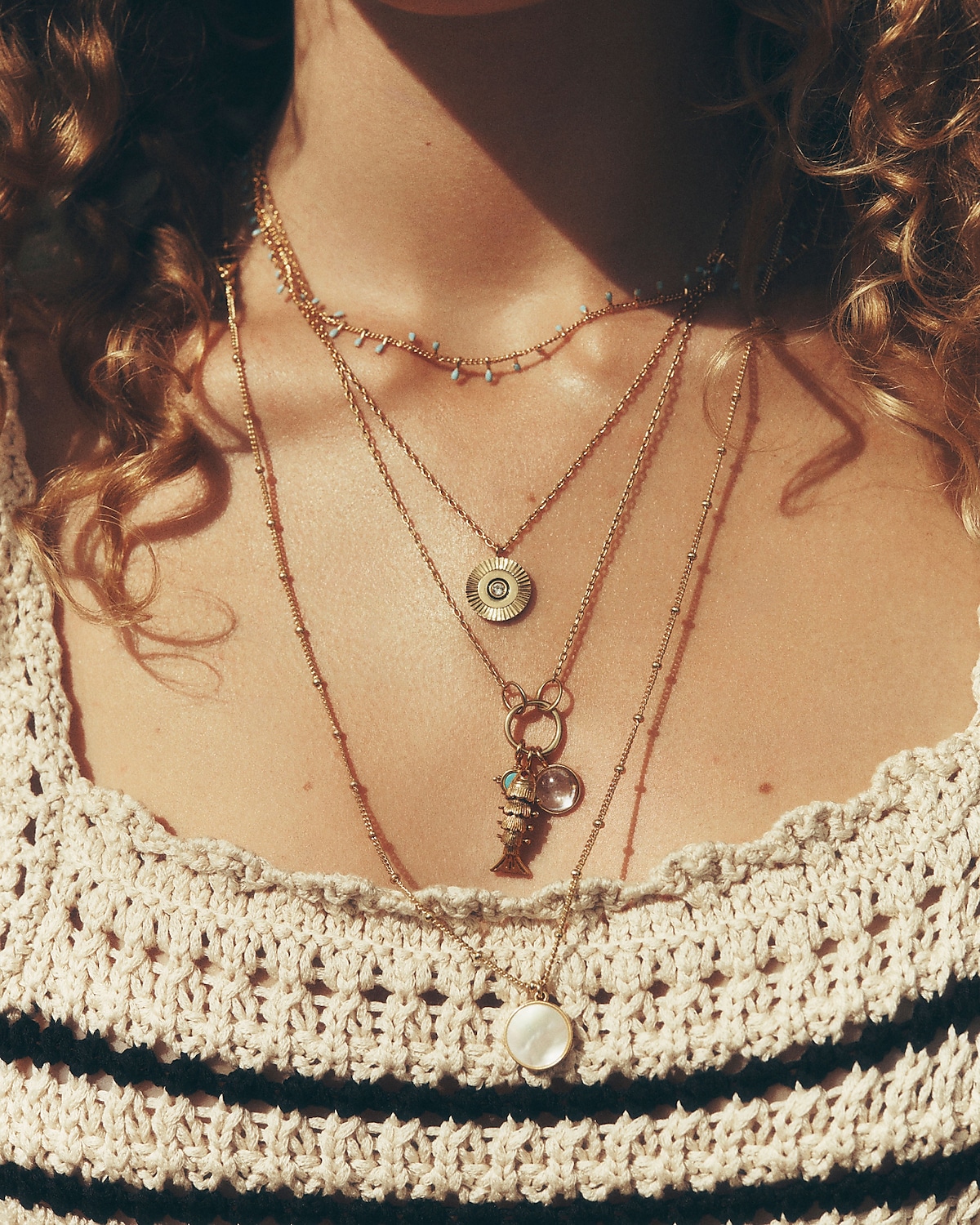 man standing in front of a parachute with classic beige shorts, white top, and a beige shirt