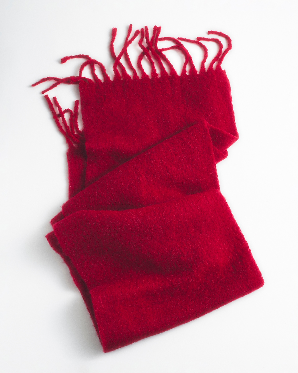 man standing in front of a parachute  with classic beige shorts, white top, and a beige shirt