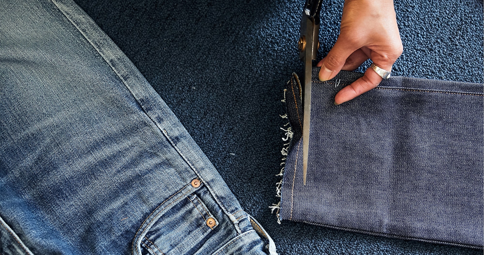 man standing in front of a parachute  with classic beige shorts, white top, and a beige shirt