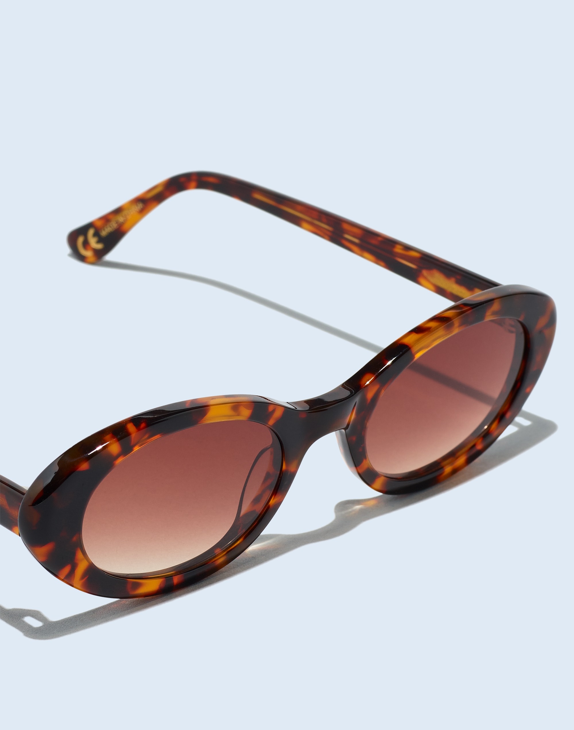 Shop Mw Russell Oval Sunglasses In Afterglow Red Tort