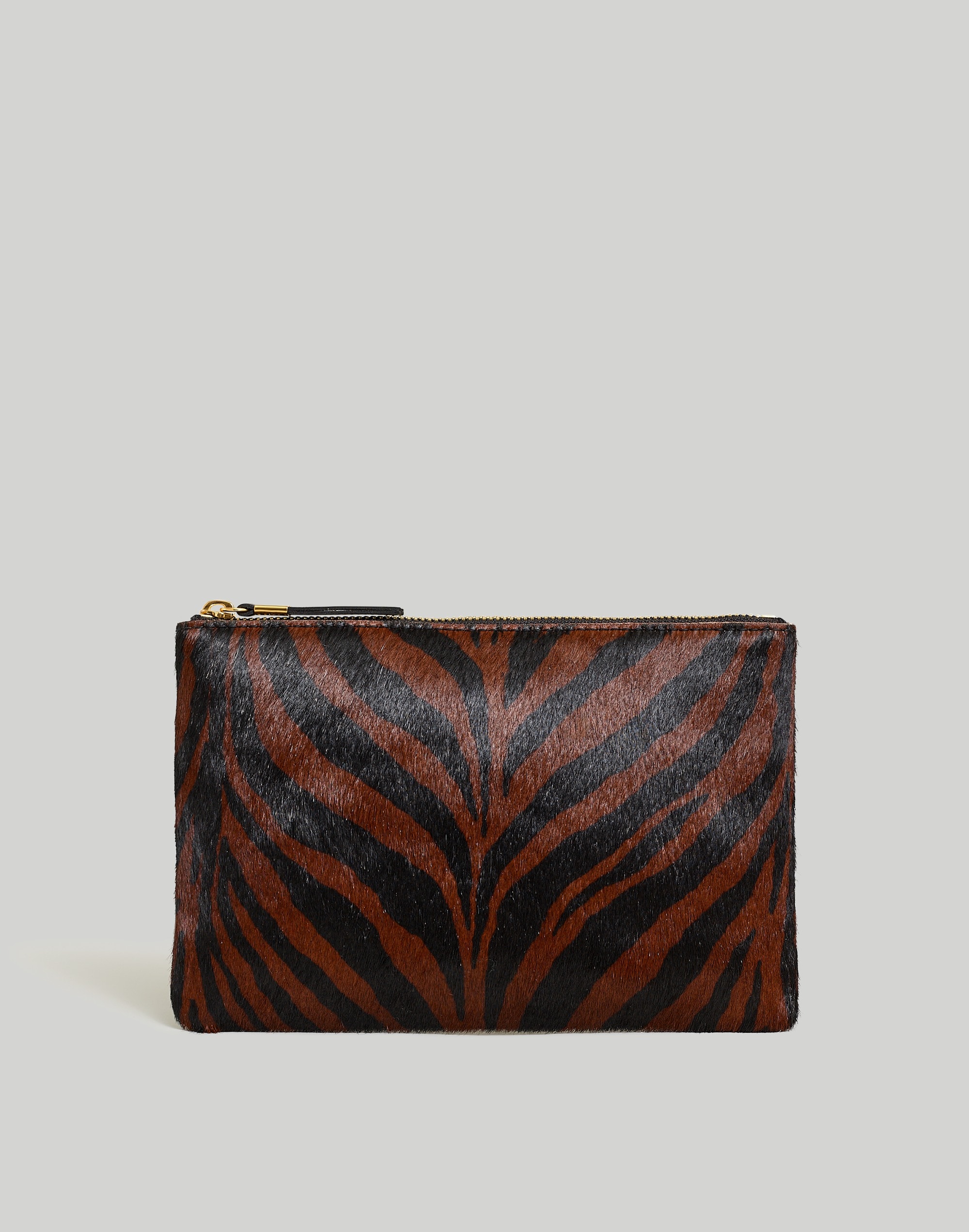 the pouch clutch in zebra calf hair