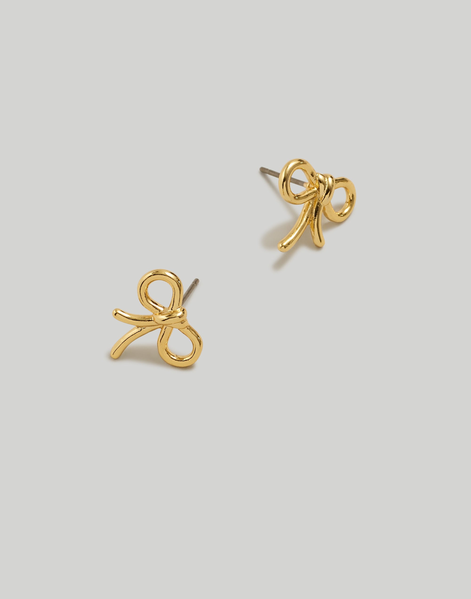 Mw Mini Bow Stud Earrings In Pale Gold