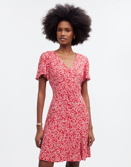 flutter sleeve mini dress Cute White Ruffle + Girly Floral Hibiscus and Pine Smocked back Front twist with cut out Unlined 100% Rayon Imported Model is wearing a size SmallModel #1 Profile Maurices Women's Floral Side Cutout