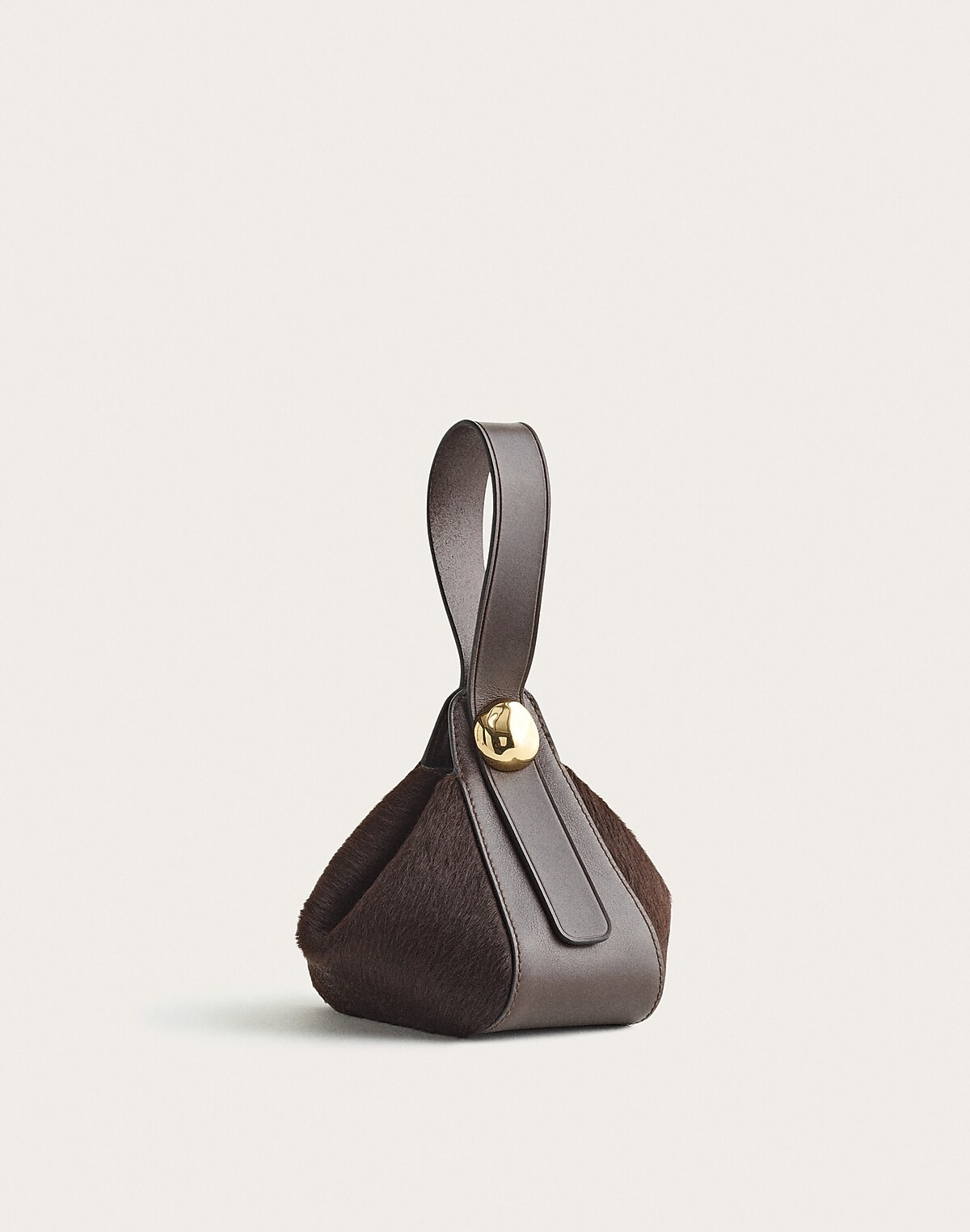 The Sculpted Metal Wristlet Bag