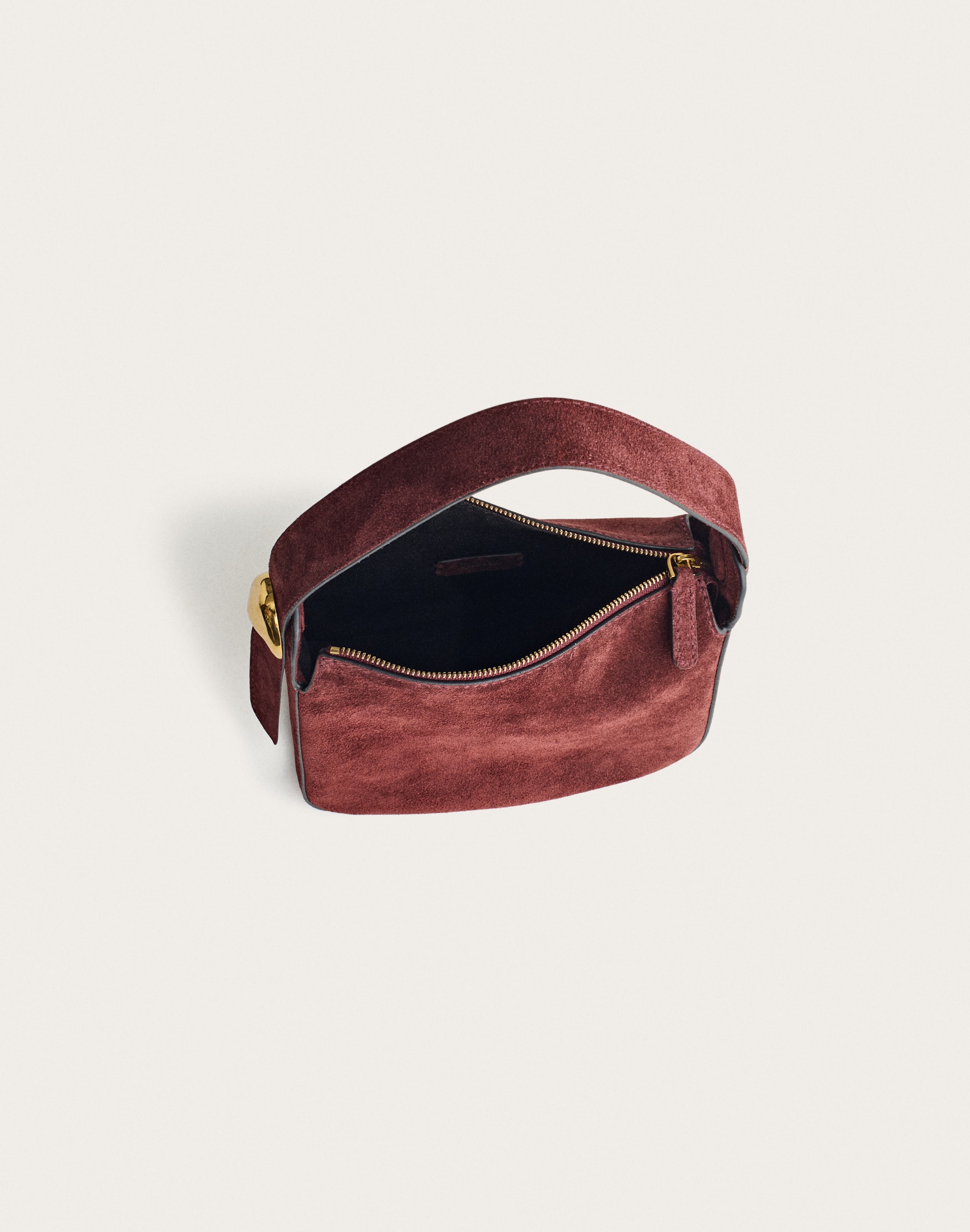 The Sculpted Metal Wristlet Bag