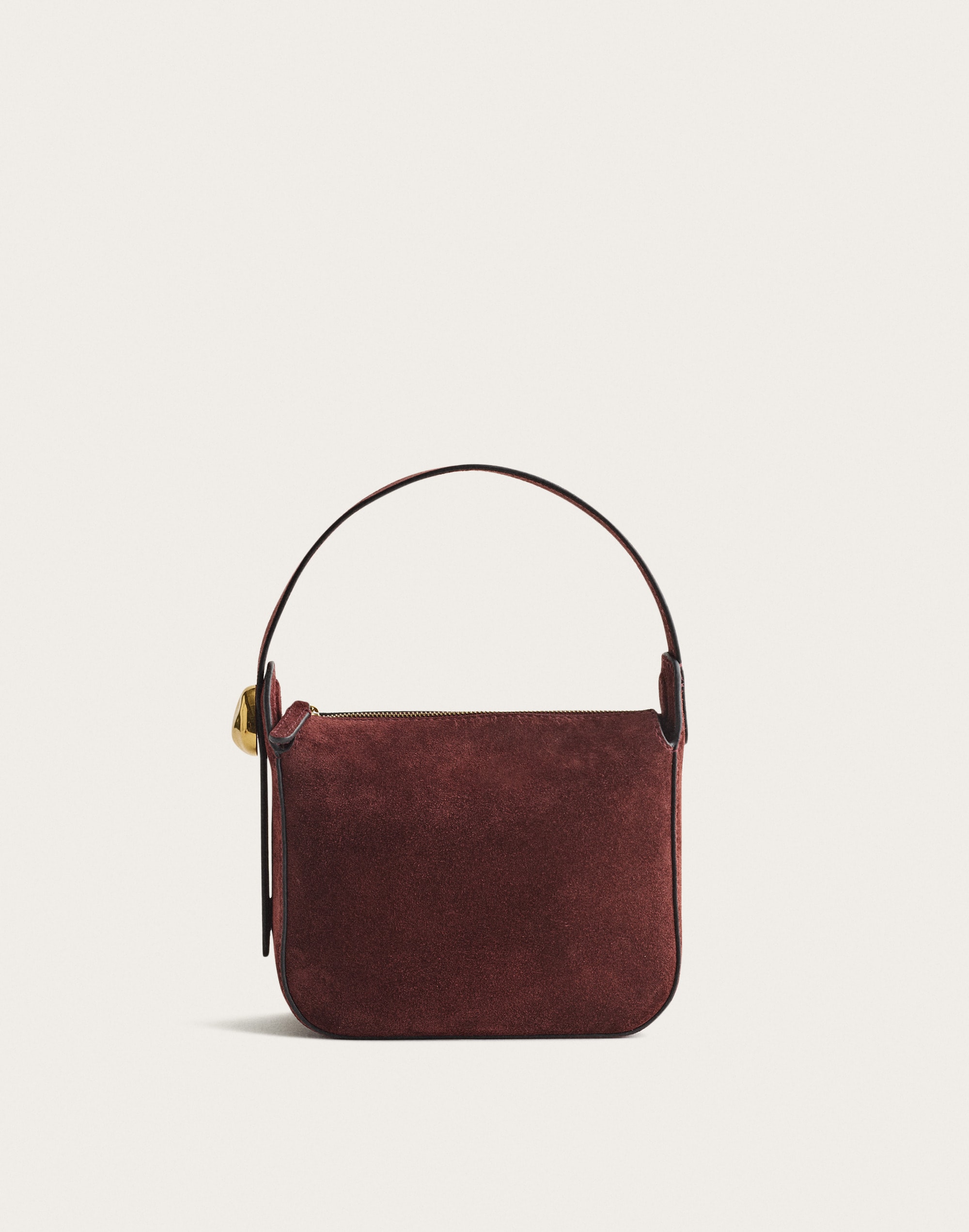 The Sculpted Metal Wristlet Bag