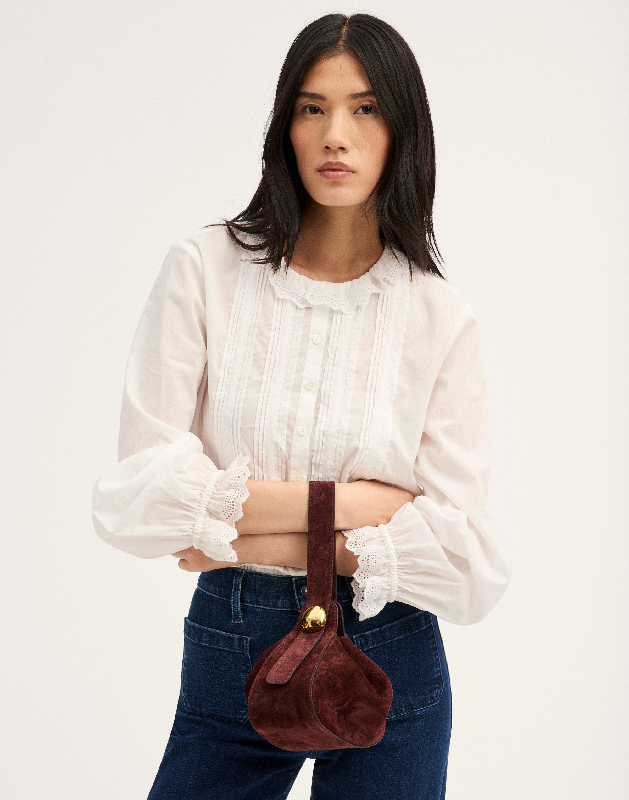 The Sculpted Metal Wristlet Bag