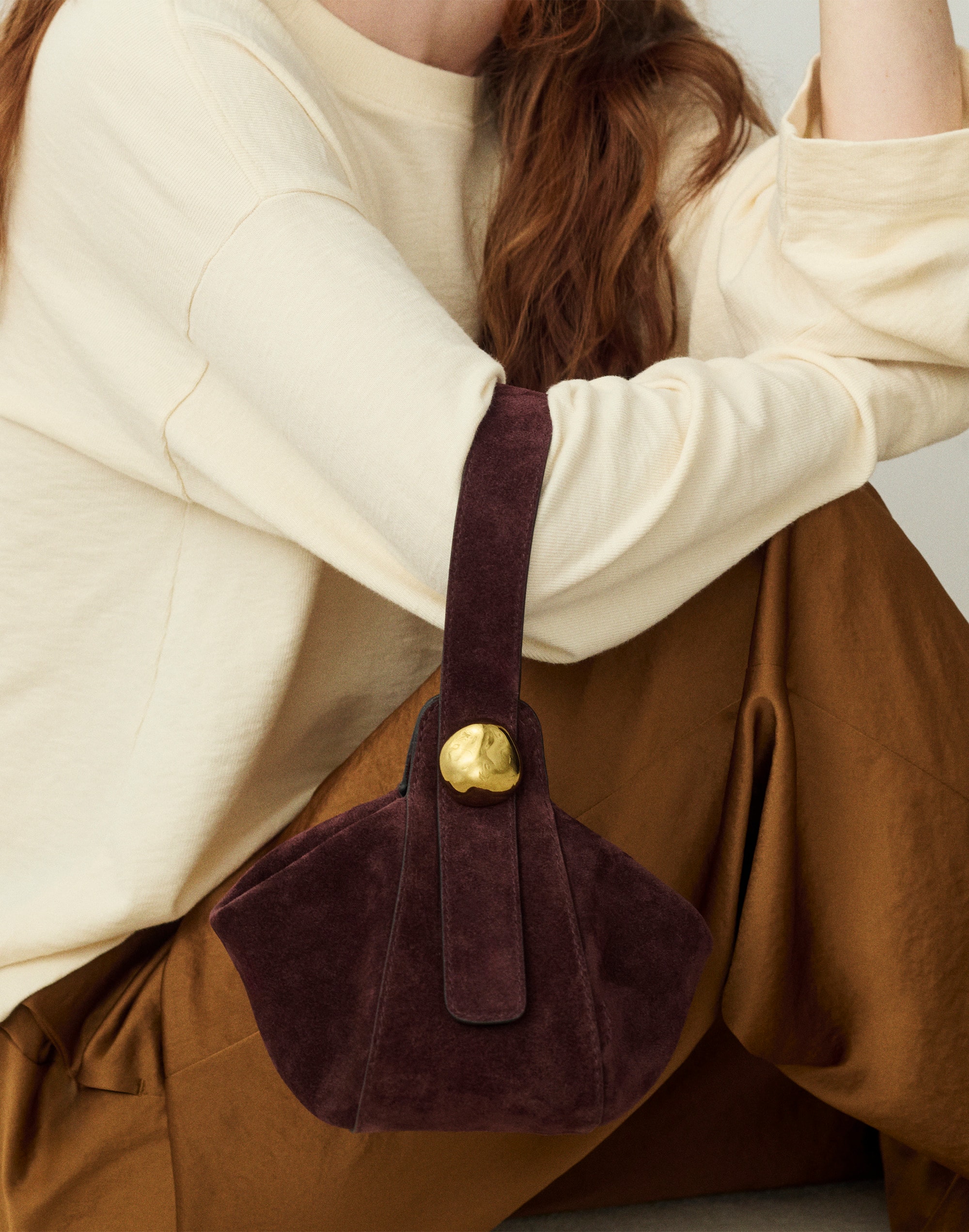 The Sculpted Metal Wristlet Bag