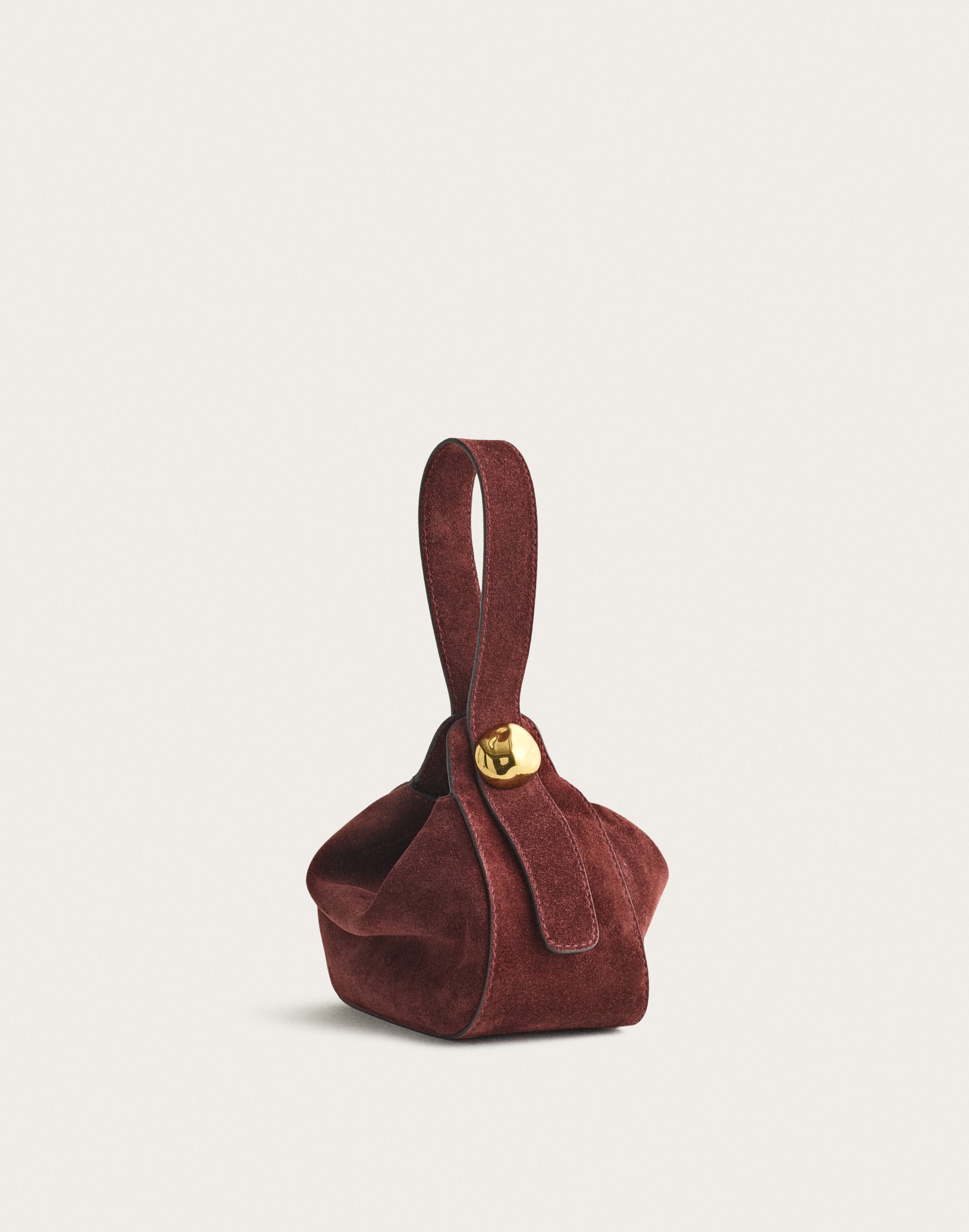 The Sculpted Metal Wristlet Bag