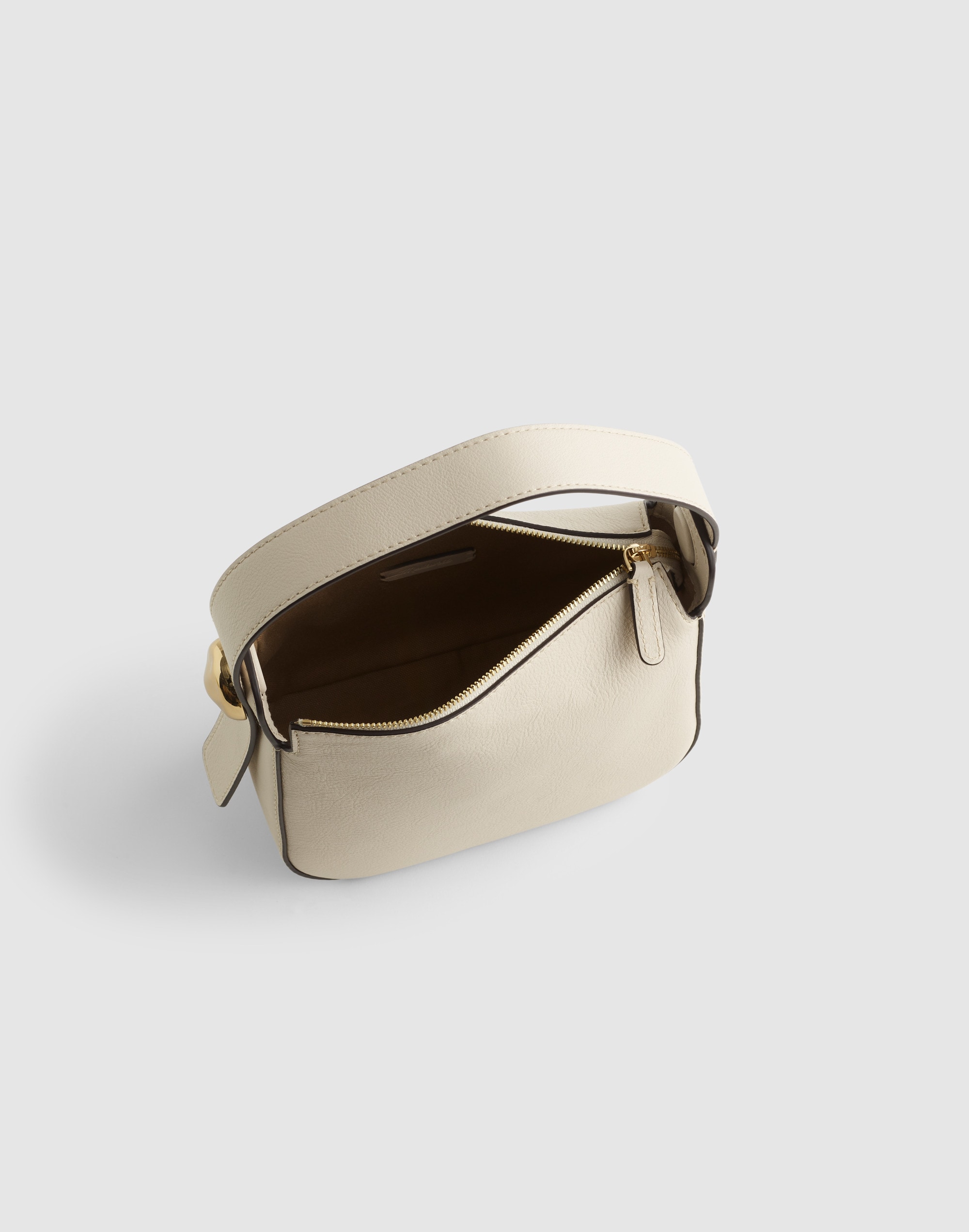 The Sculpted Metal Wristlet Bag