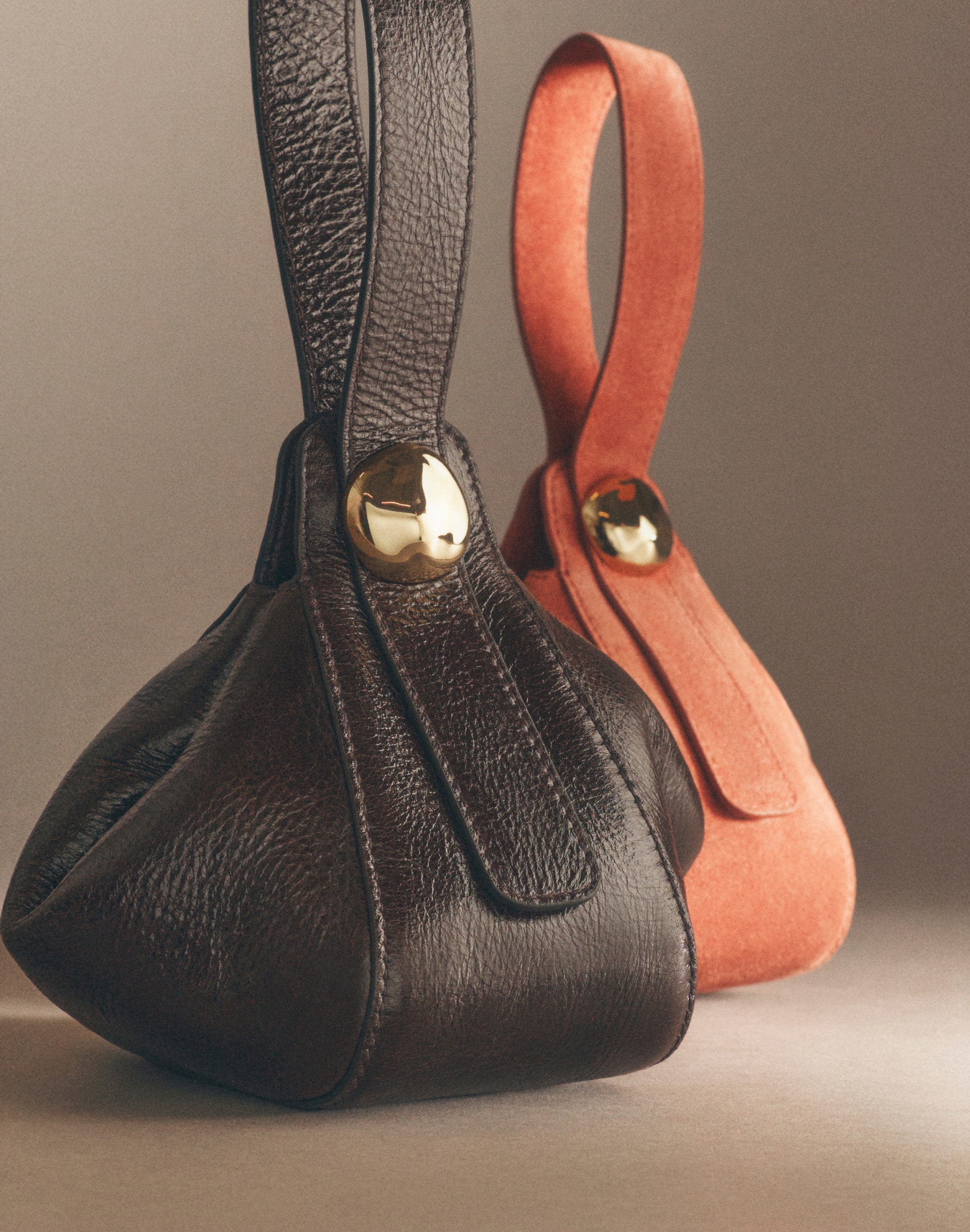 The Sculpted Metal Wristlet Bag