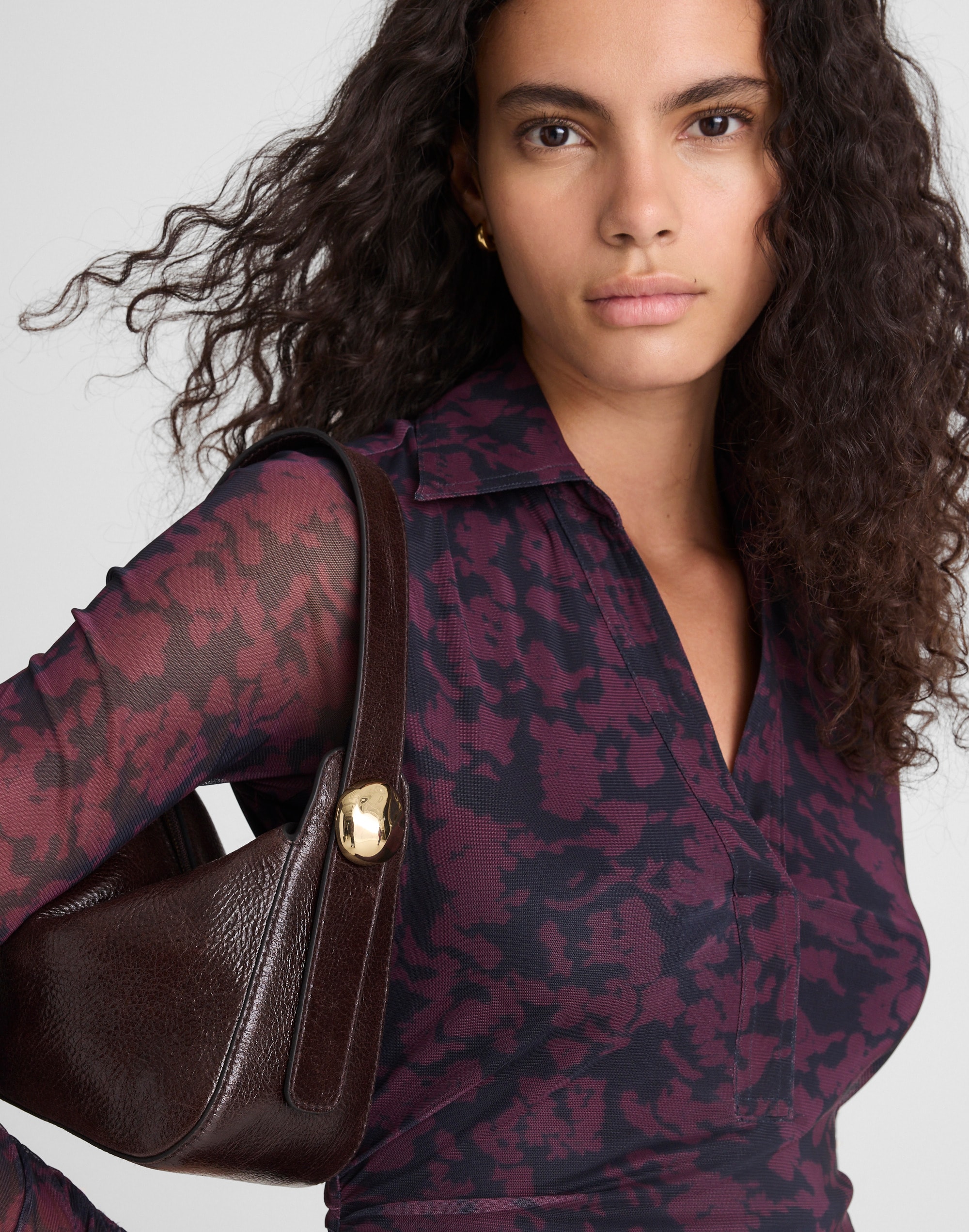 The Sculpted Metal Wristlet Bag