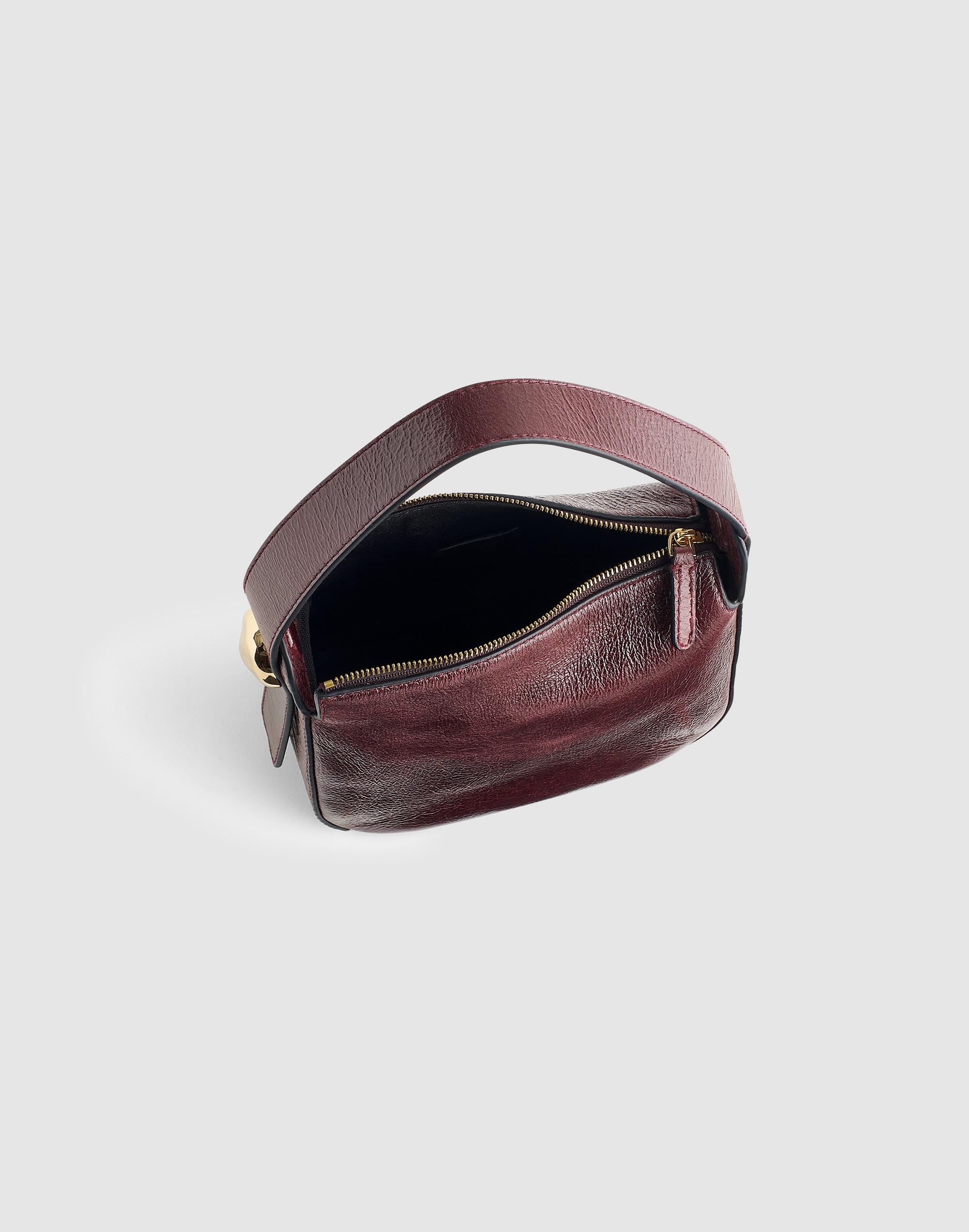 The Sculpted Metal Wristlet Bag