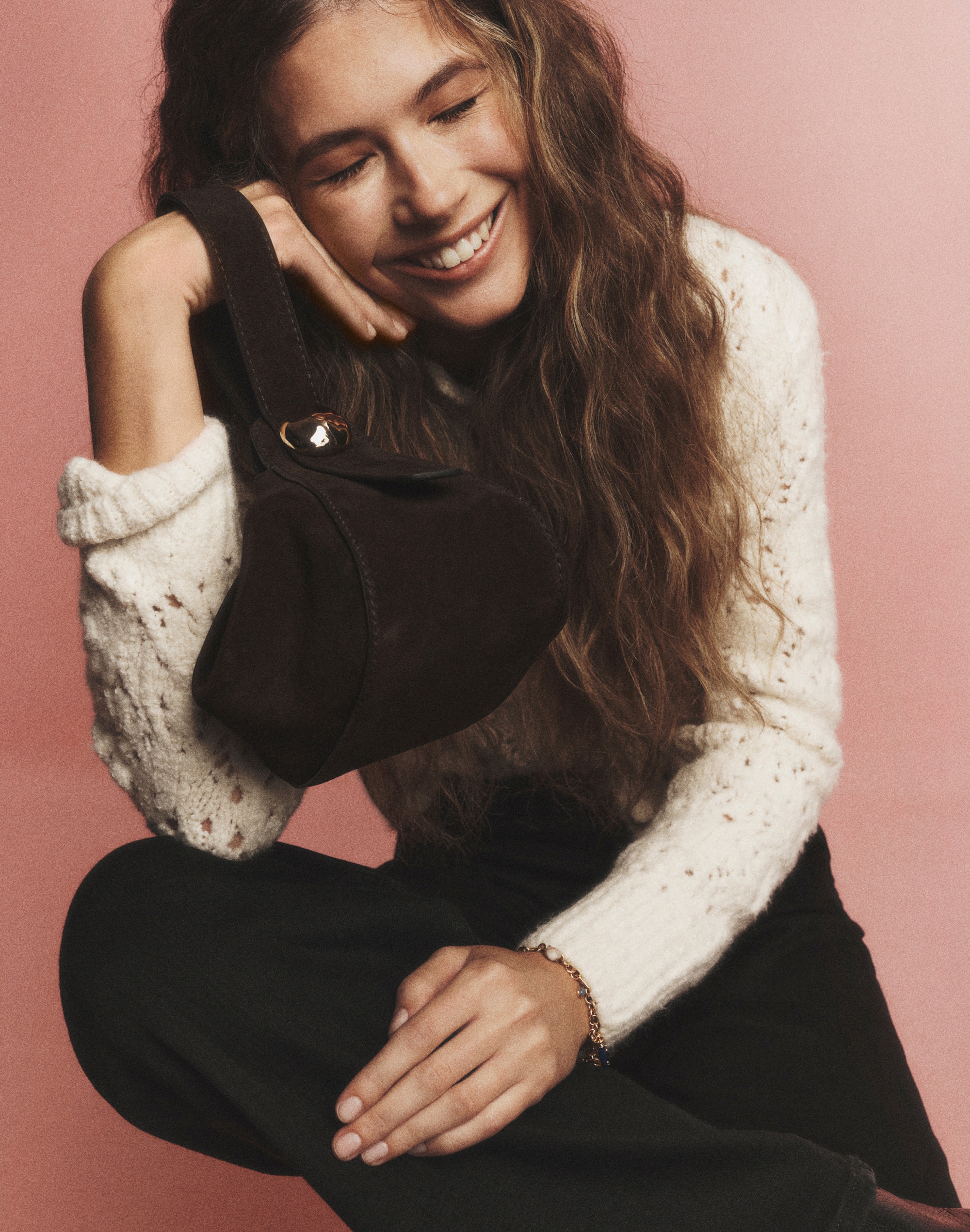 The Sculpted Metal Wristlet Bag