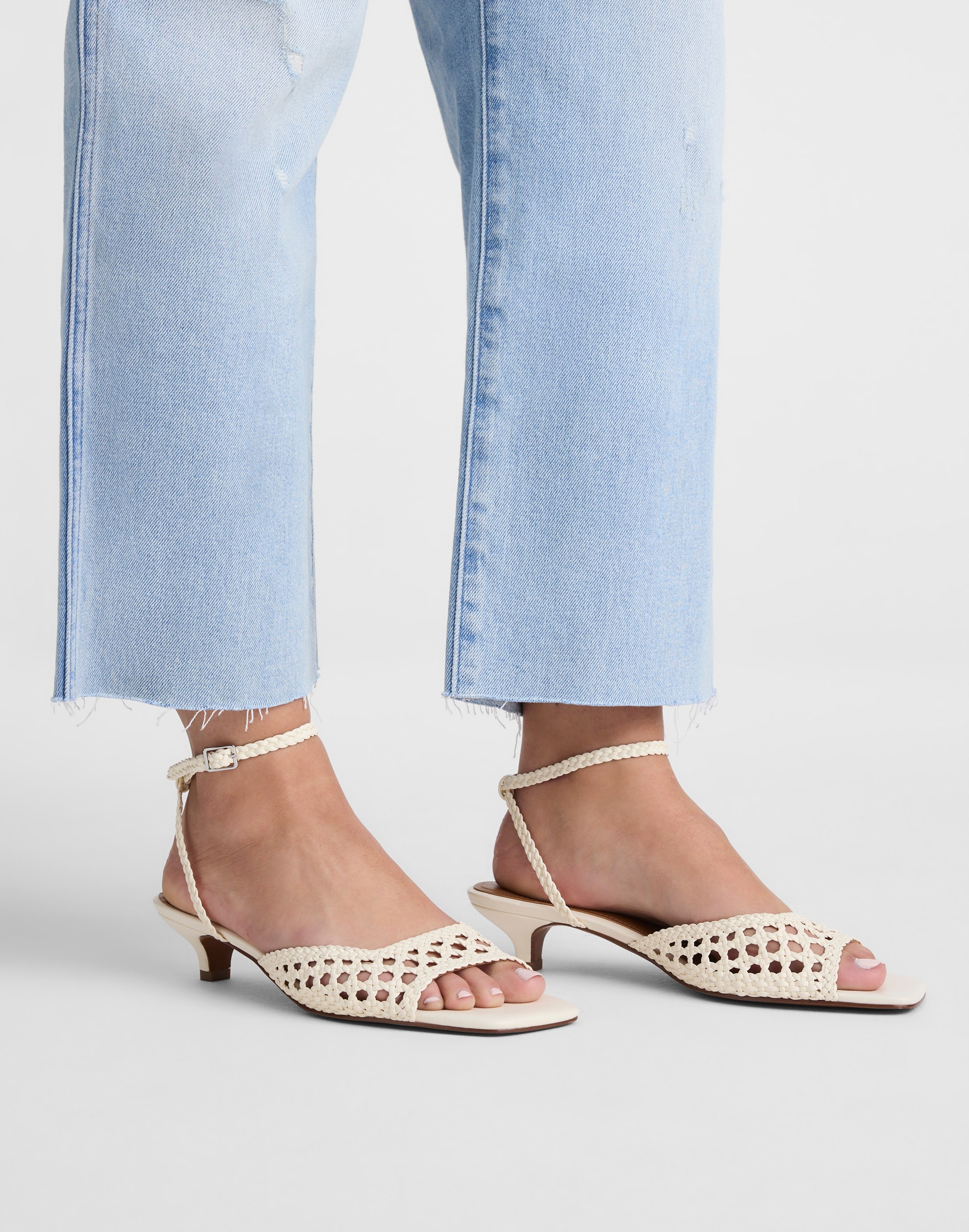 The Tyra Ankle-Strap Kitten-Heel Sandal in Woven Leather