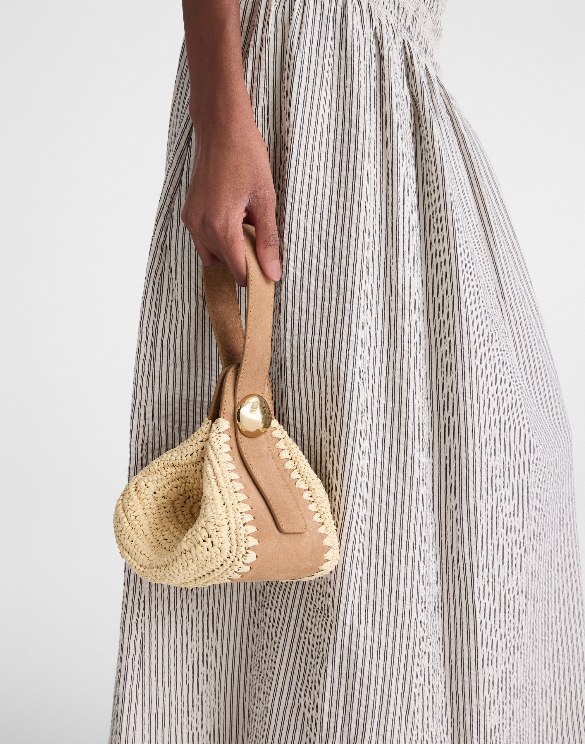 The Sculpted Metal Wristlet Bag