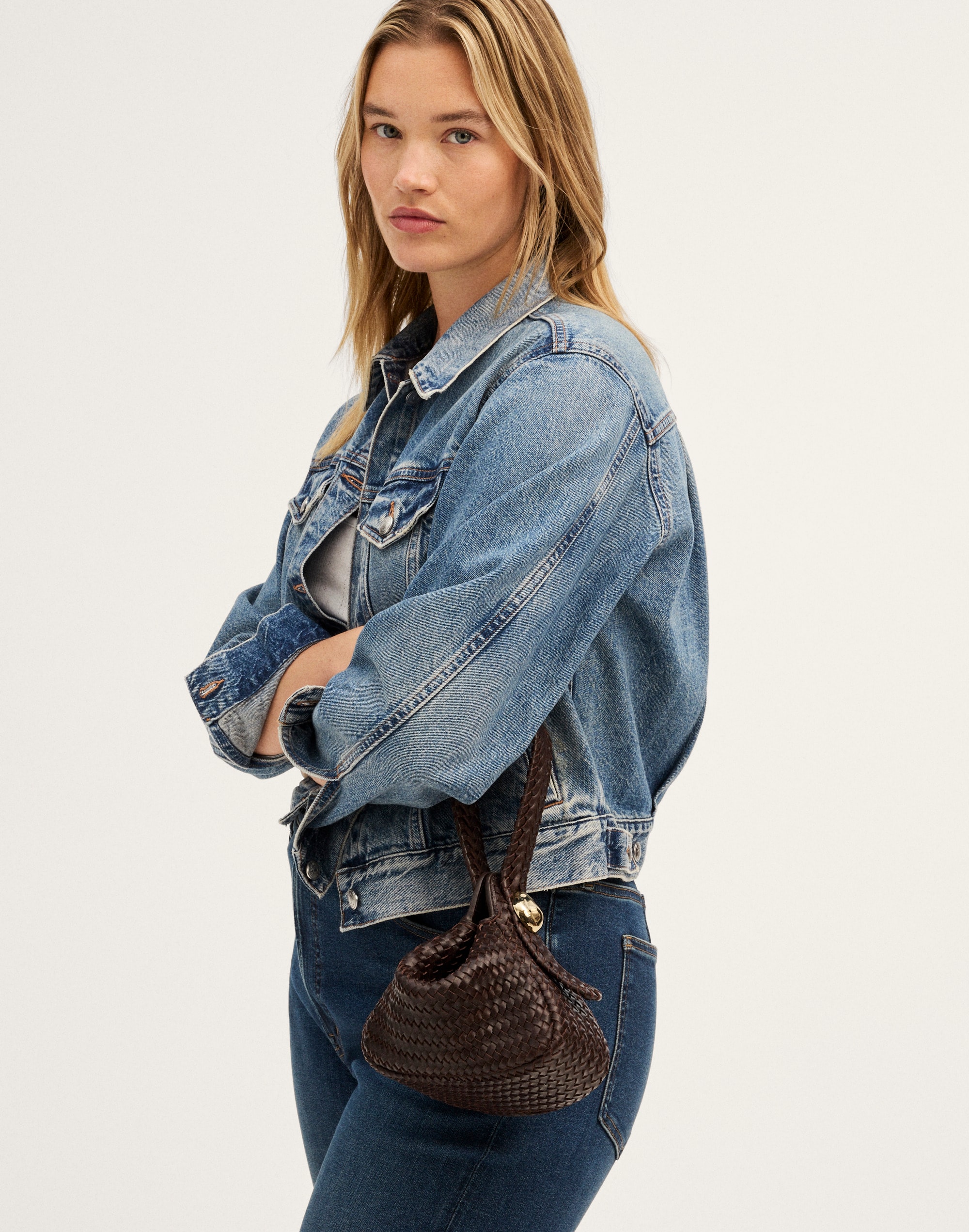 The Sculpted Metal Wristlet Bag